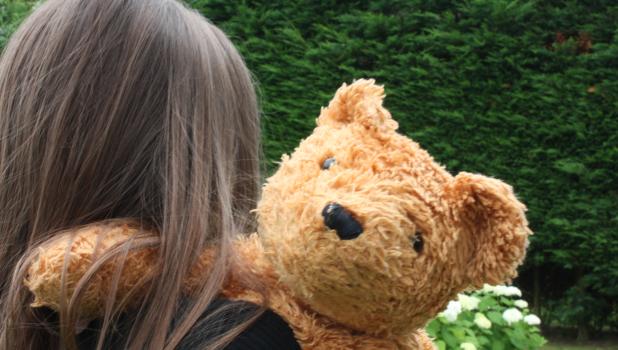 Teddy bear comforts Ukrainian girl